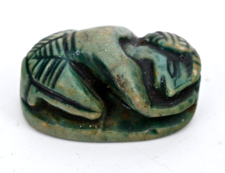 Egyptian Green-Glazed Steatite Scaraboid Surmounted by a Crouching Figure