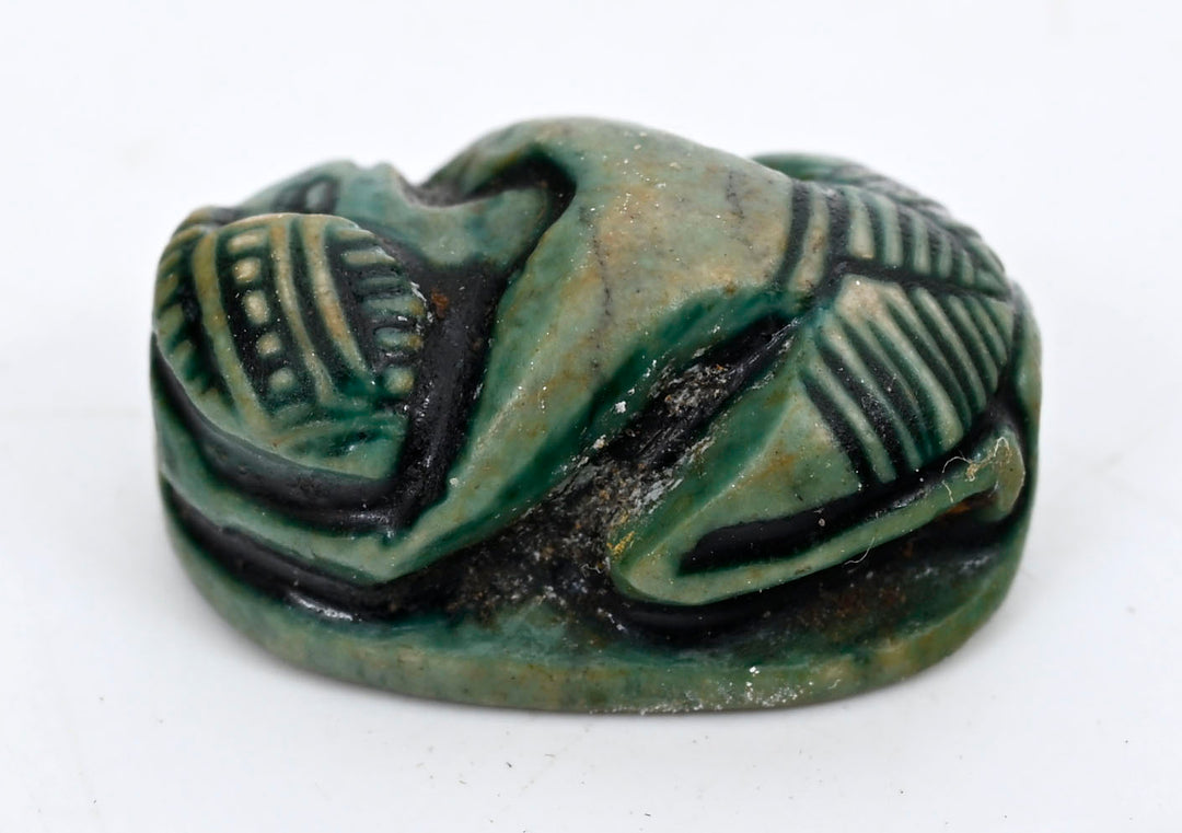 Egyptian Green-Glazed Steatite Scaraboid Surmounted by a Crouching Figure