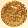 Three Moche Gold Applique Discs Embossed with Warriors