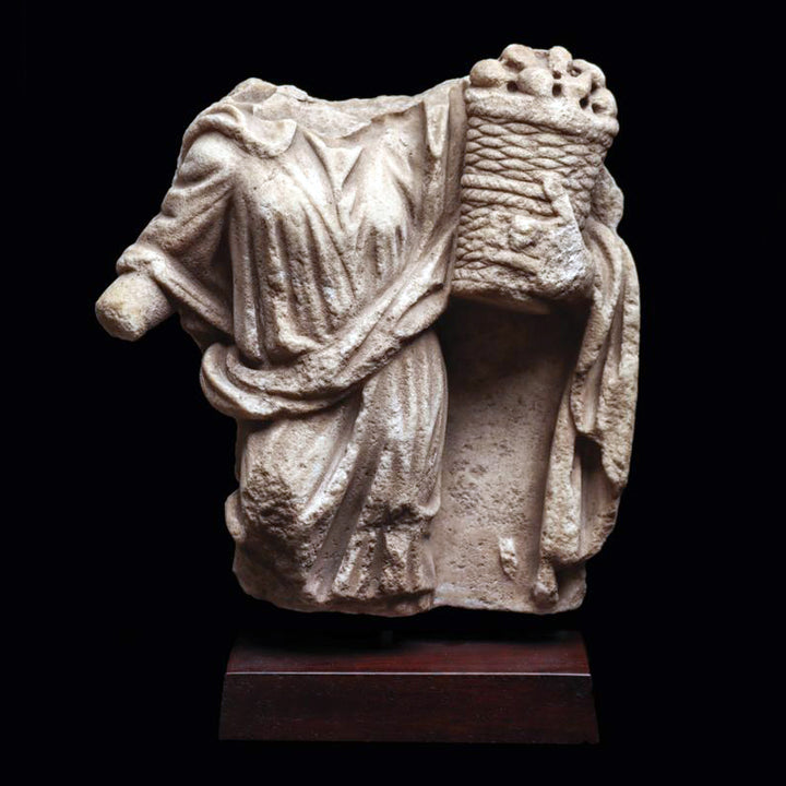 Roman Marble Relief Fragment of a Female holding a Casket