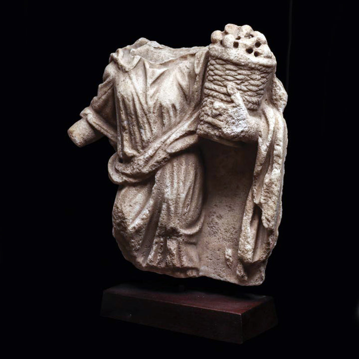 Roman Marble Relief Fragment of a Female holding a Casket