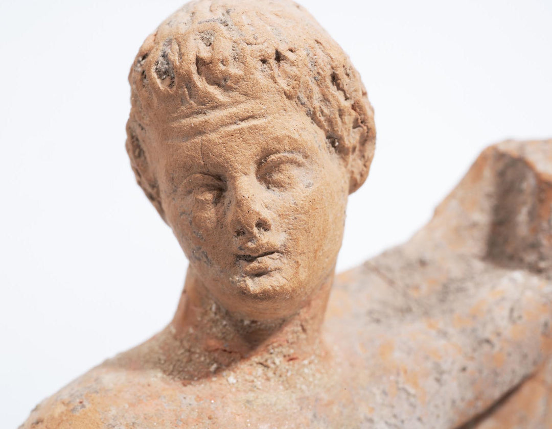 Greek terracotta statuette of a Kneeling Nude Female