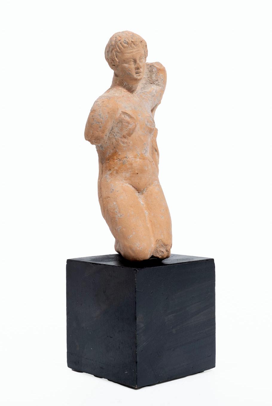 Greek terracotta statuette of a Kneeling Nude Female