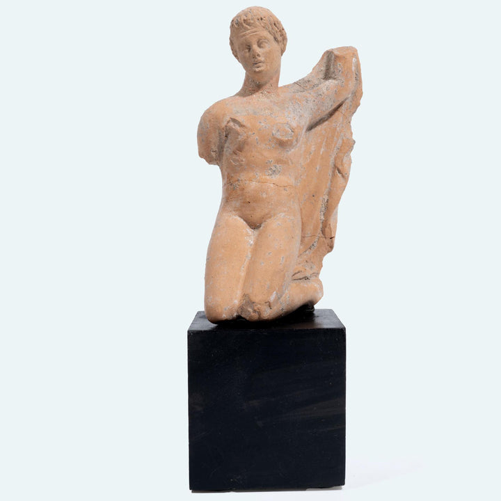 Greek terracotta statuette of a Kneeling Nude Female