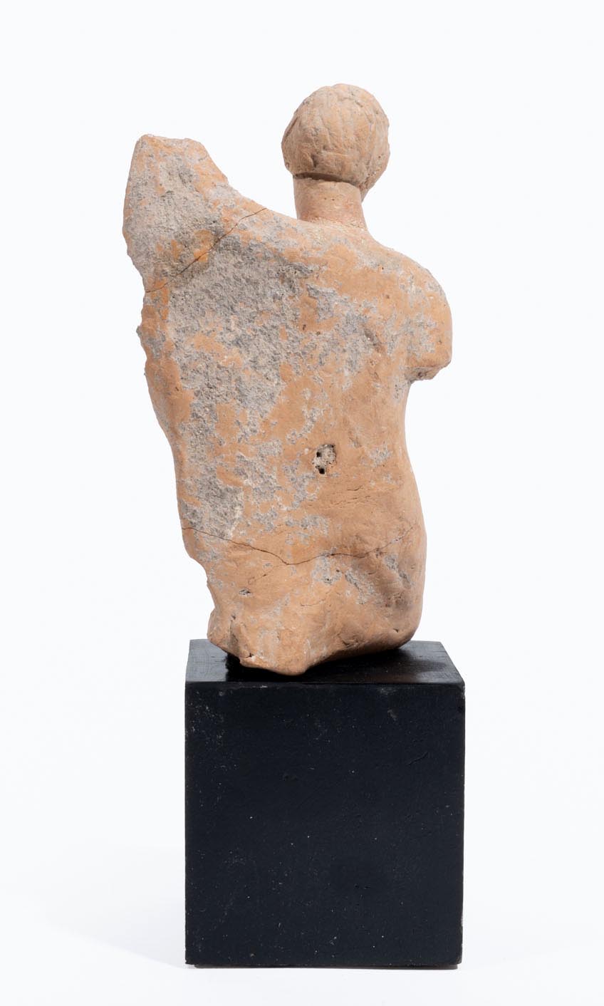 Greek terracotta statuette of a Kneeling Nude Female