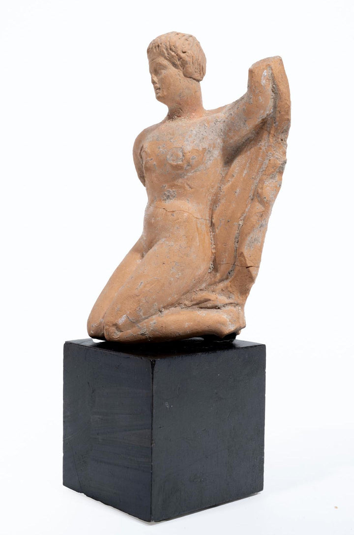 Greek terracotta statuette of a Kneeling Nude Female