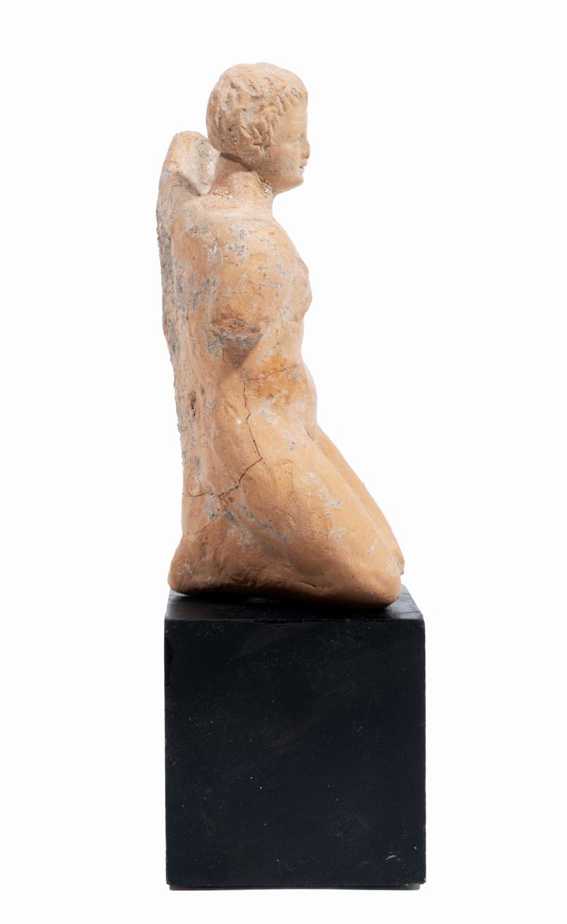 Greek terracotta statuette of a Kneeling Nude Female