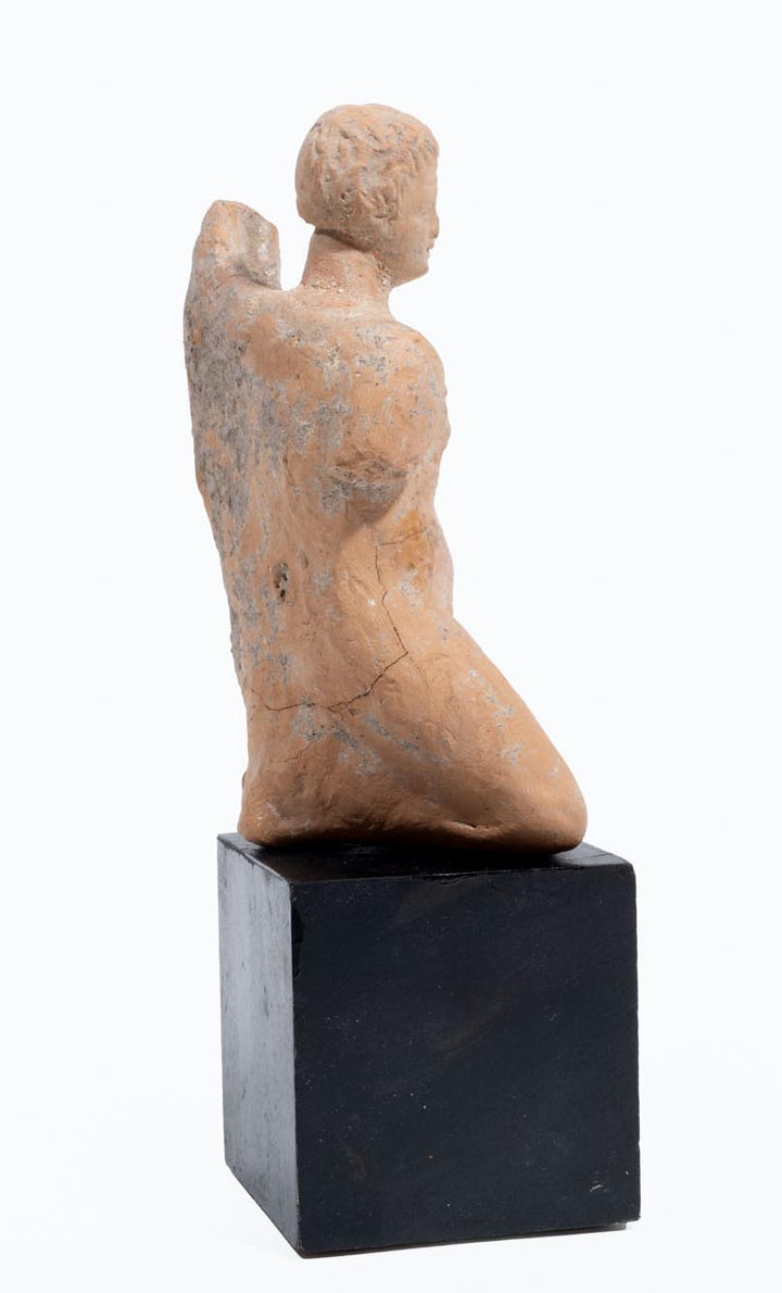 Greek terracotta statuette of a Kneeling Nude Female