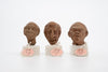 Group of three Hellenistic Alexandrian terracotta grotesque character heads