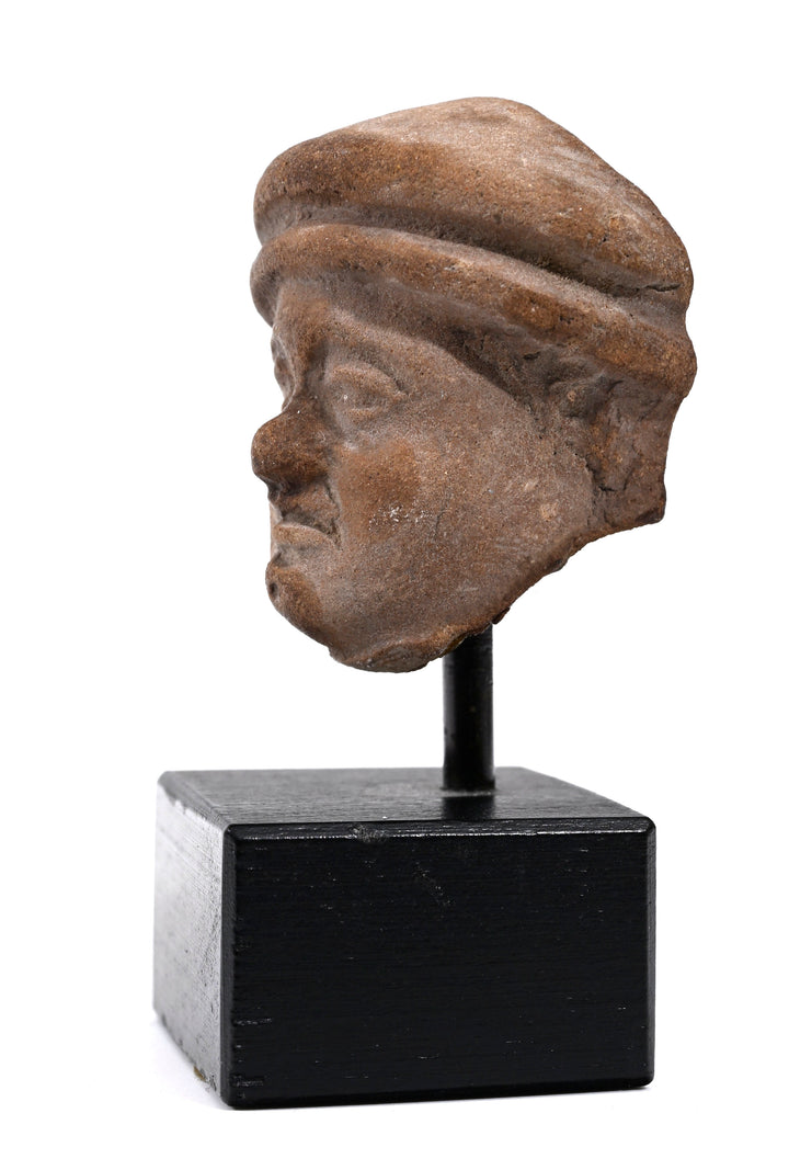 Hellenistic Terracotta Head of a Man in Cap