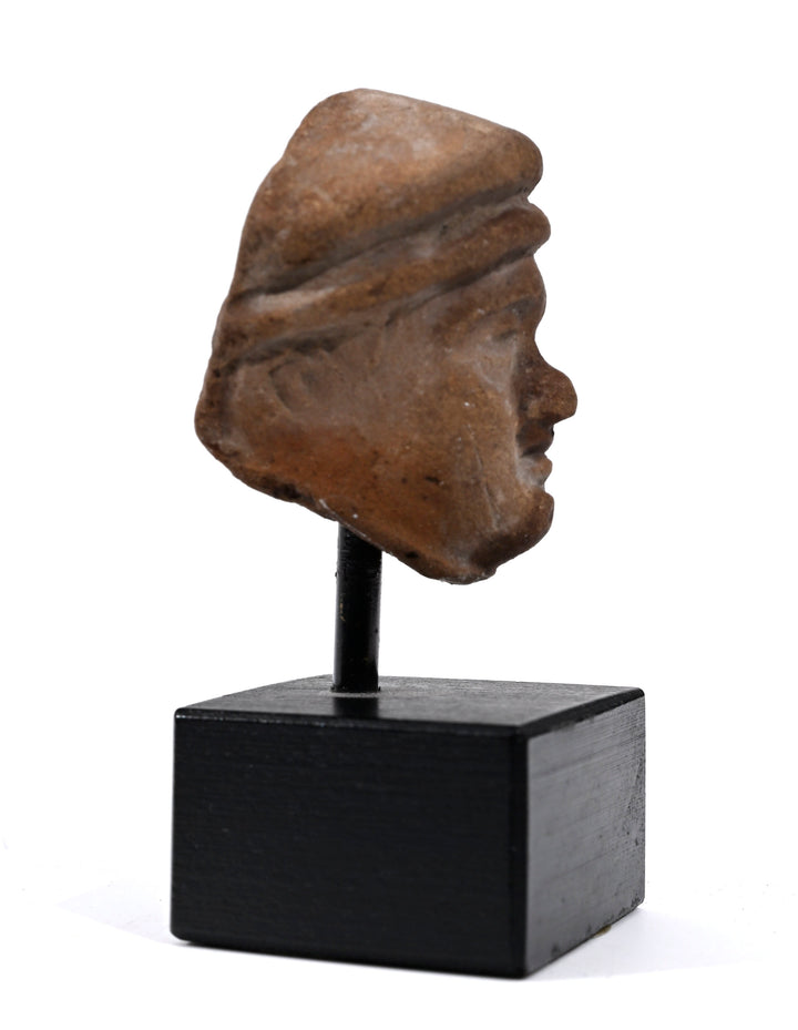 Hellenistic Terracotta Head of a Man in Cap