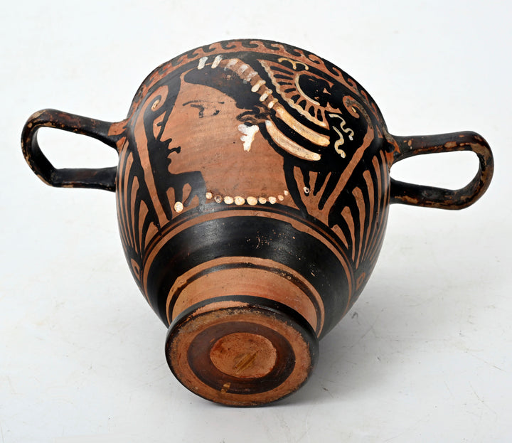 Apulian red-figure skyphos, palmette handle ornament and wave-band rim detail