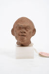 Group of three Hellenistic Alexandrian terracotta grotesque character heads