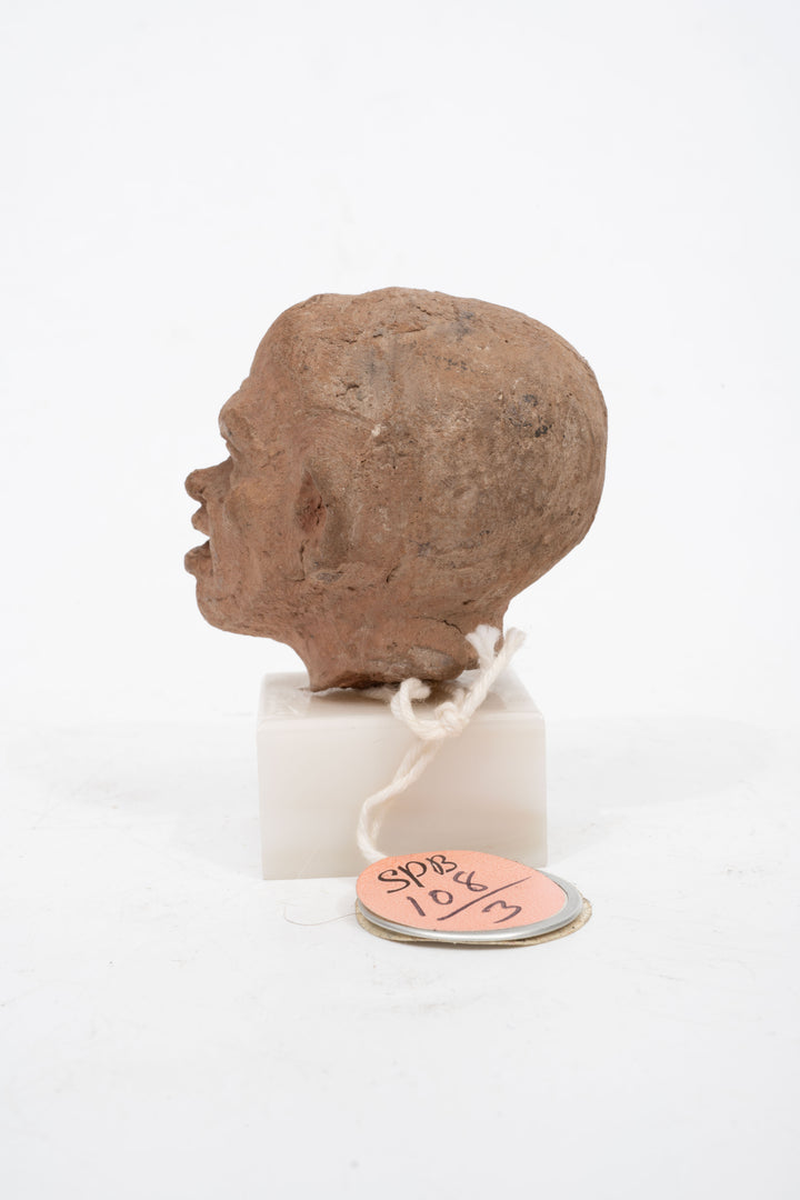 Group of three Hellenistic Alexandrian terracotta grotesque character heads