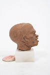 Group of three Hellenistic Alexandrian terracotta grotesque character heads