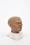Group of three Hellenistic Alexandrian terracotta grotesque character heads