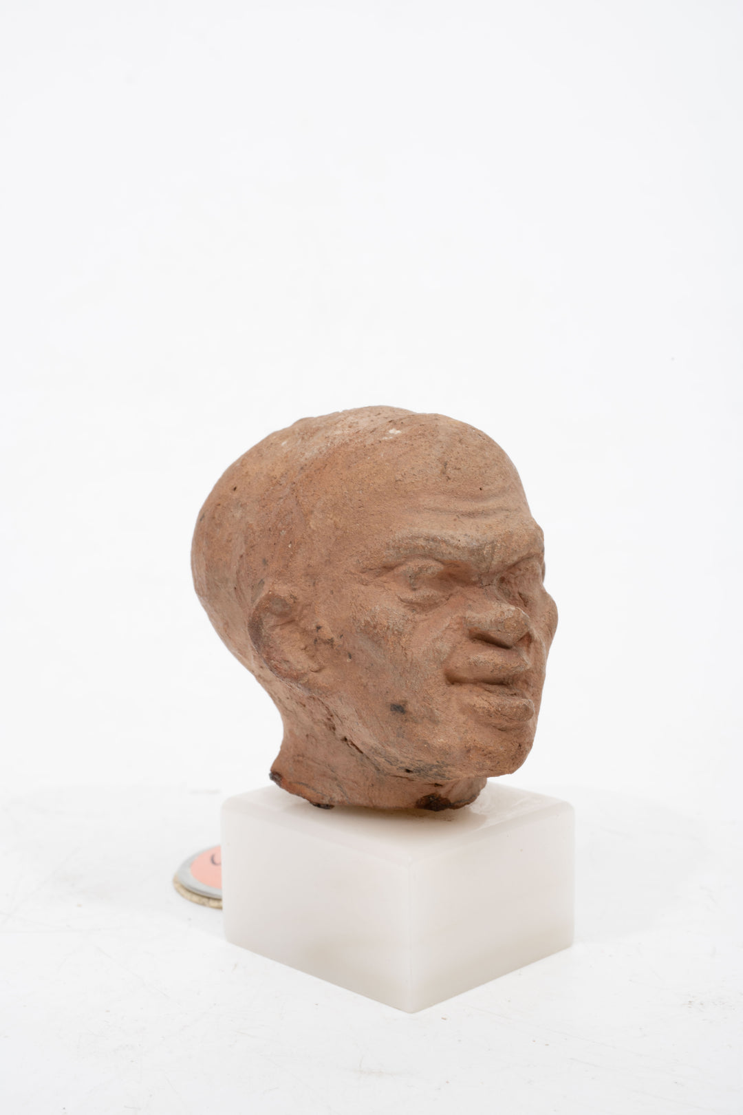 Group of three Hellenistic Alexandrian terracotta grotesque character heads
