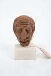 Group of three Hellenistic Alexandrian terracotta grotesque character heads
