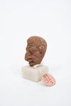 Group of three Hellenistic Alexandrian terracotta grotesque character heads
