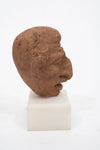 Group of three Hellenistic Alexandrian terracotta grotesque character heads