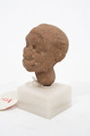 Group of three Hellenistic Alexandrian terracotta grotesque character heads