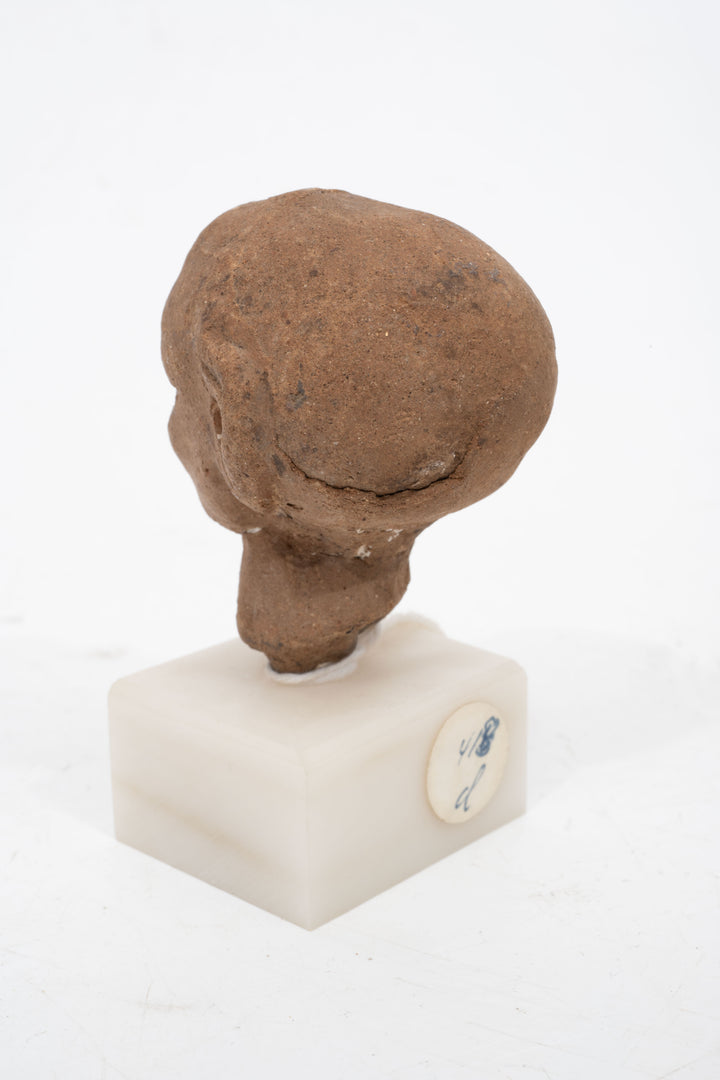 Group of three Hellenistic Alexandrian terracotta grotesque character heads