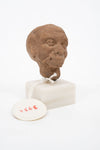 Group of three Hellenistic Alexandrian terracotta grotesque character heads